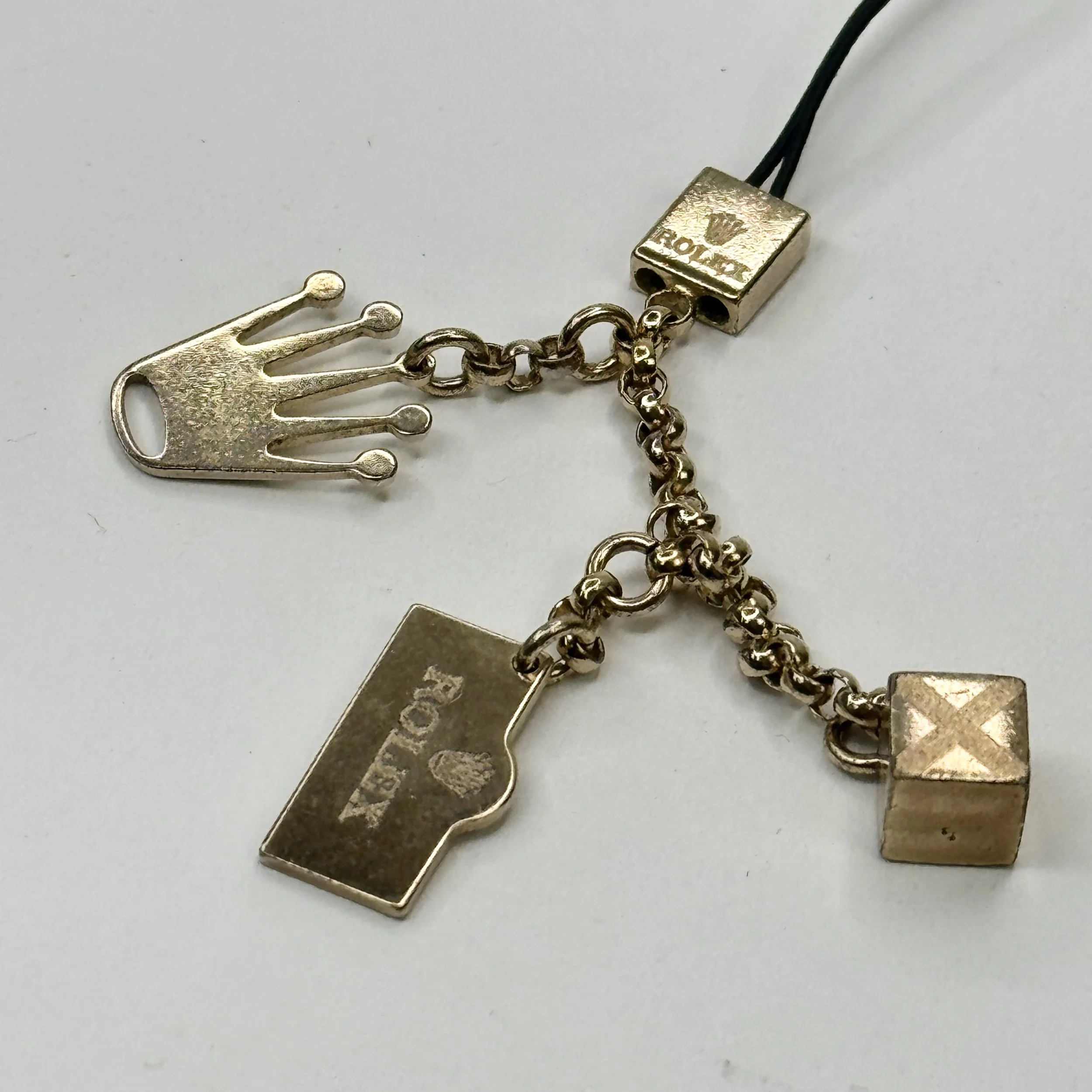 Vintage Rolex Gold Charm Accessory with Box – Collectible Tri-Charm